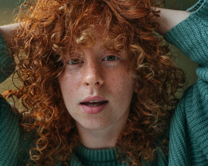 woman with curly red hair