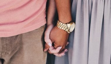 couple holding hands and standing together closely