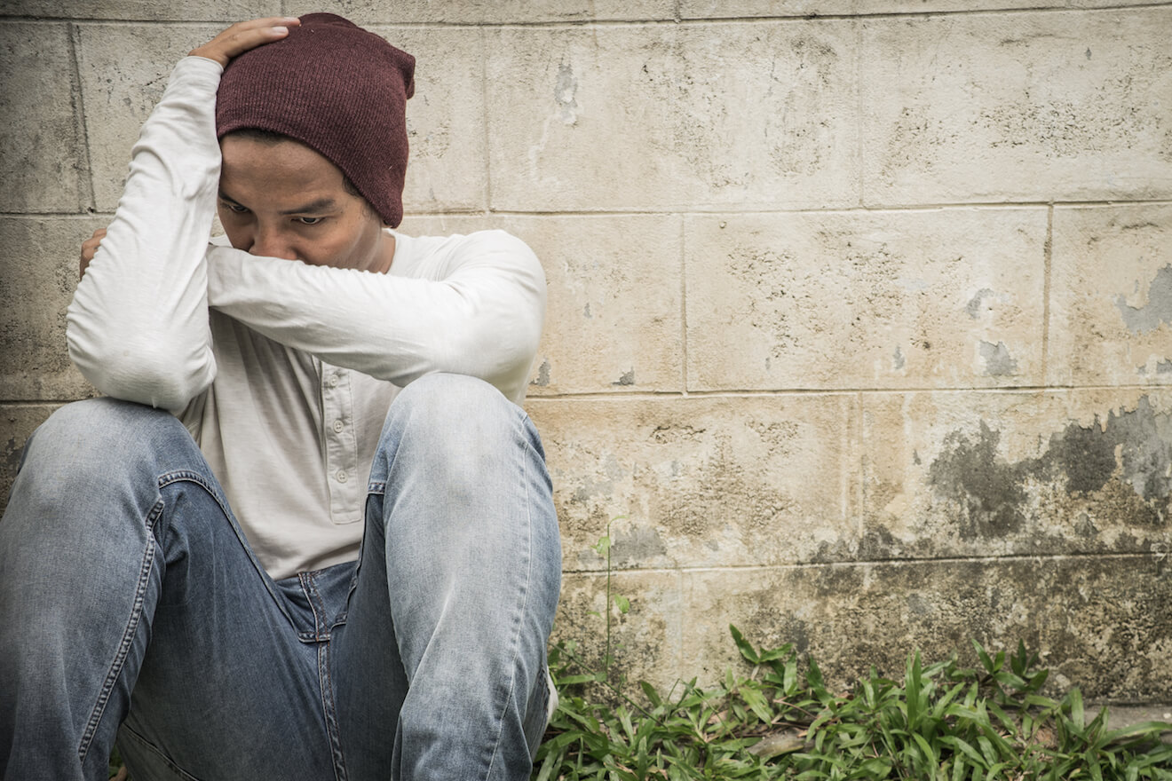 Hip young man feeling frustrated and alone