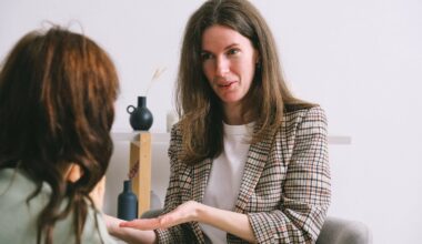 woman speaking to young woman motioning with hands