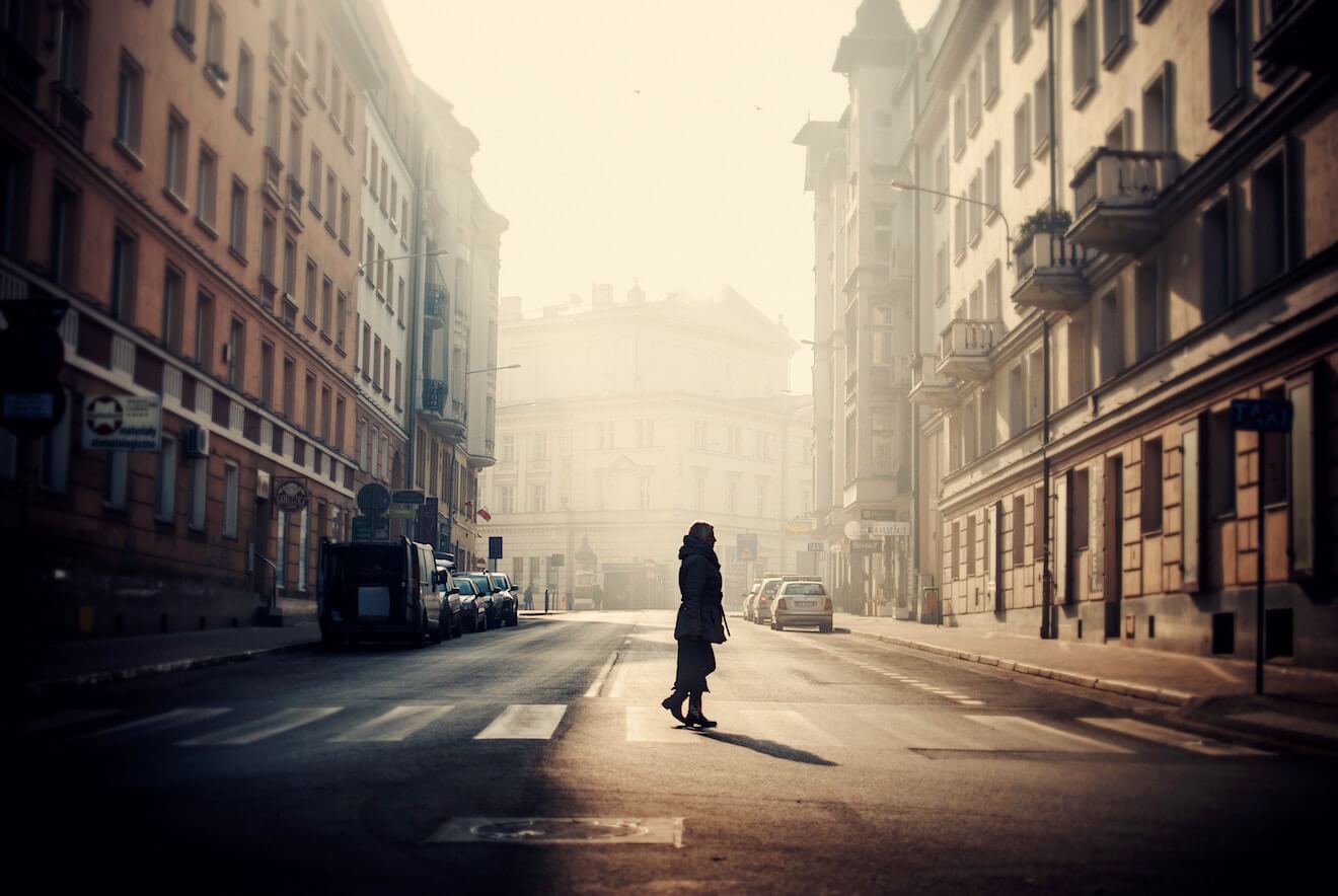 Woman alone in New York City with buildings