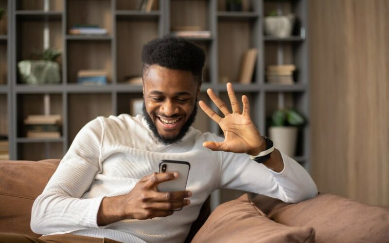 Man smiling at phone