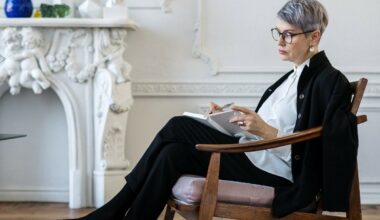 woman sitting on chair taking notes